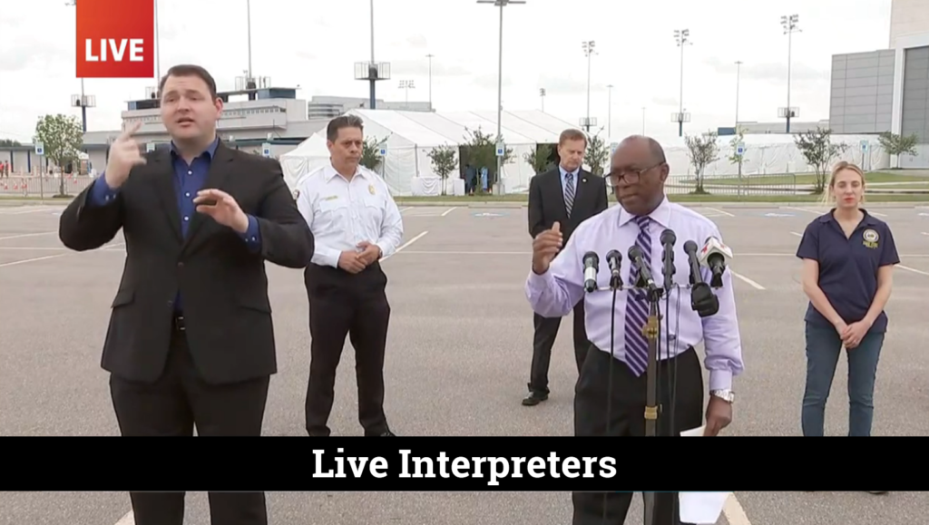 A group of people with a live interpreter